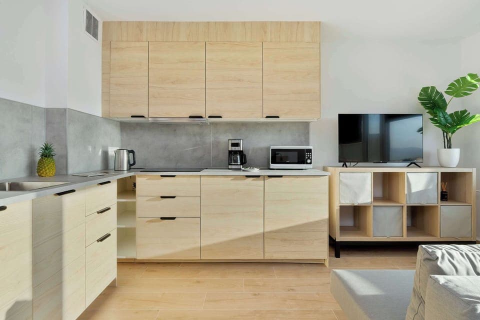 The fully equipped kitchenette includes everything you need for a home-cooked meal.