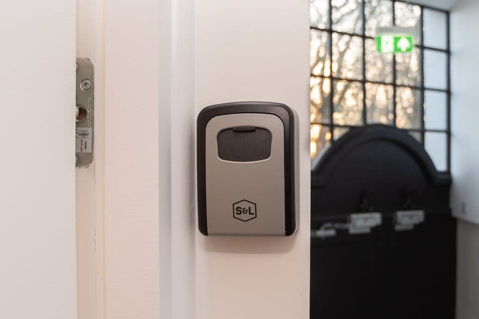 A secure lockbox providing easy self check-in for convenient, hassle-free access to the apartment.