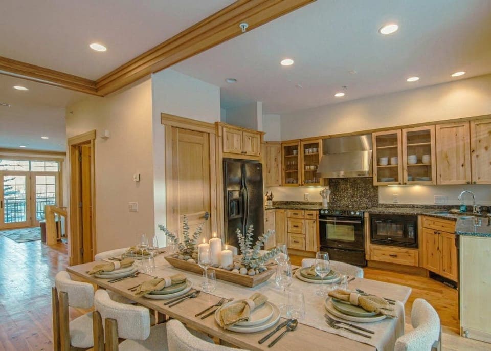 Dining area. Open space with kitchen, 8 seats table access to private patio