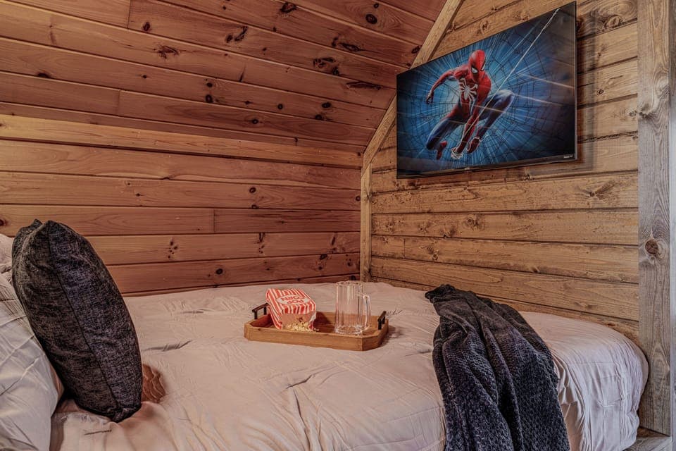 Bedroom 3 with 2 x queen neds with TVs, and Games room