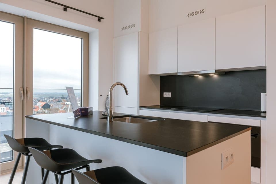 The fully equipped kitchen offers everything you need for a gourmet stay, including a state-of-the-art oven and induction cooktop.