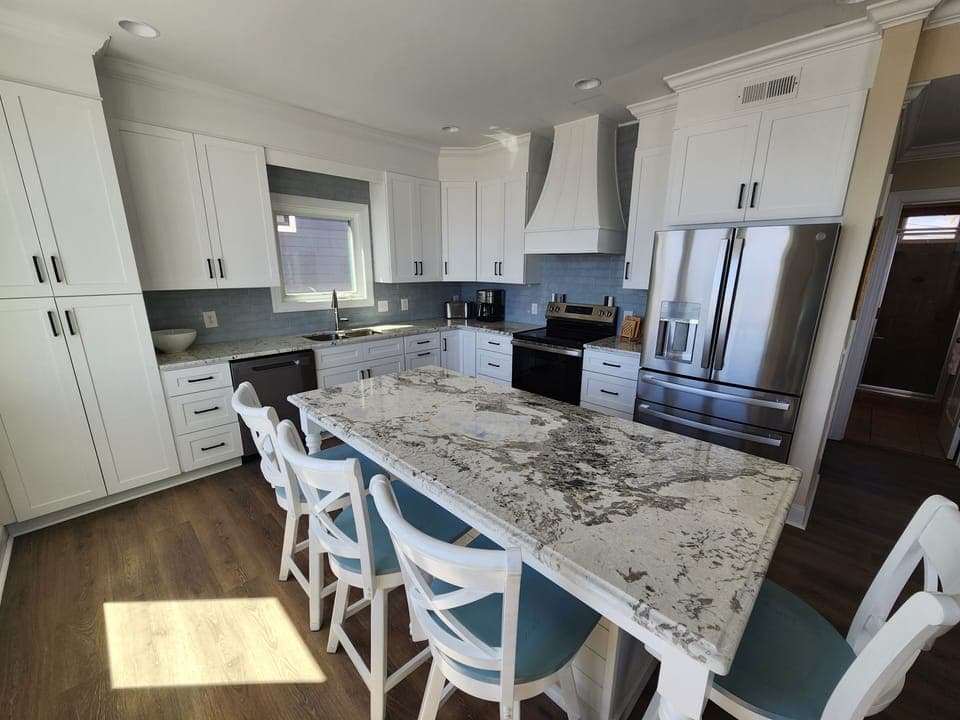 You'll love preparing meals in this stunning kitchen featuring granite countertops, stainless steel appliances, and an island perfect for gathering with loved ones.