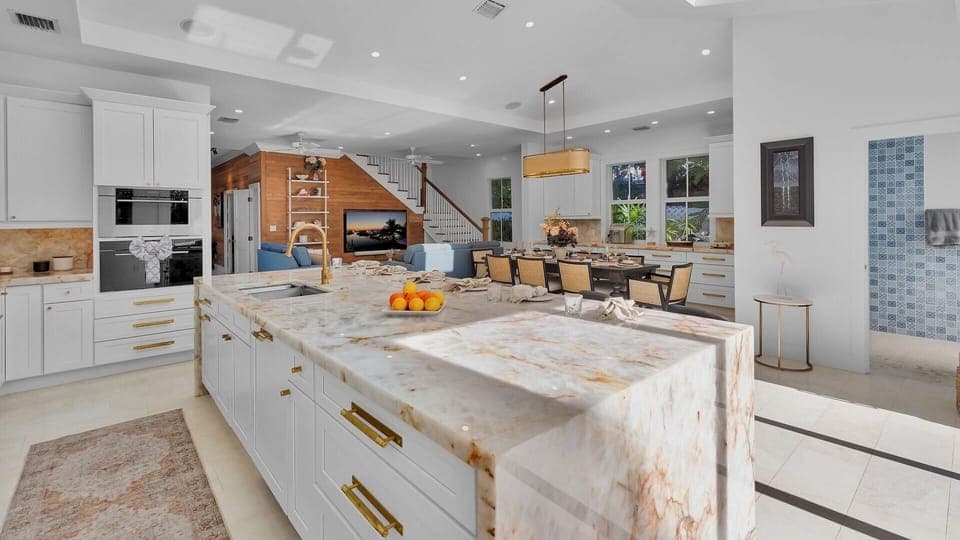 Your gourmet kitchen features marble countertops, high-end appliances, and an open layout perfect for cooking and entertaining.