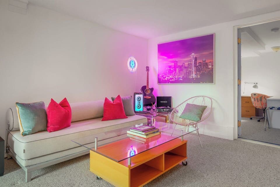 Fun lounge with neon and vibrant accents 