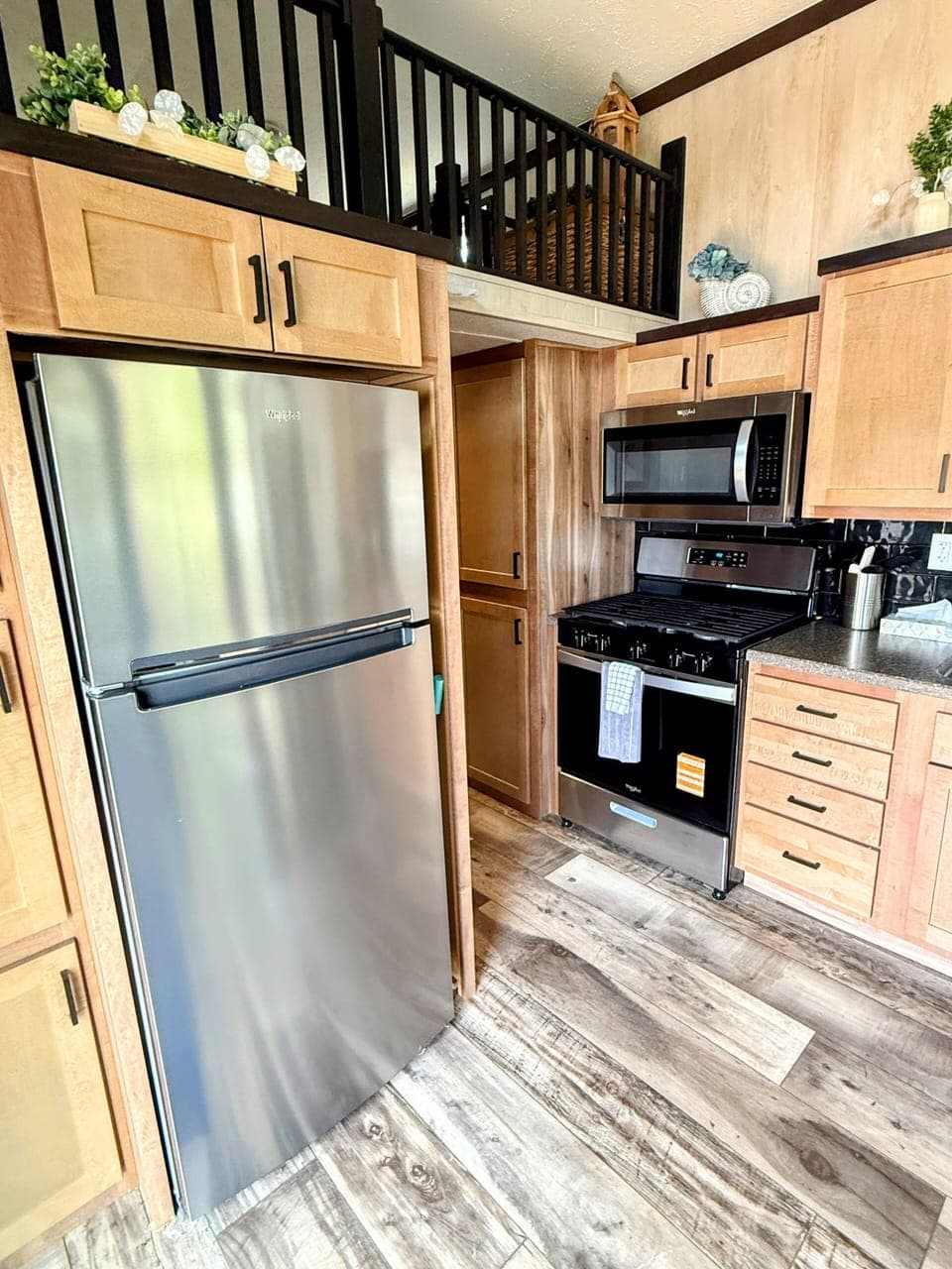Funky Island - Well-appointed kitchen with a fridge and oven, making cooking easy and convenient.
