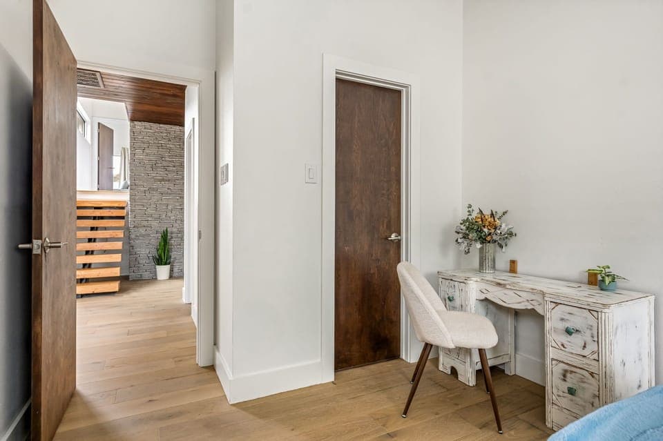 Cozy guest bedroom with desk, perfect for work or reading