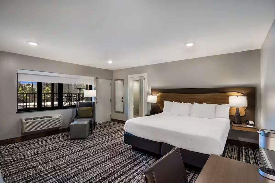 Stretch out on a crisp king bed in airy comfort.