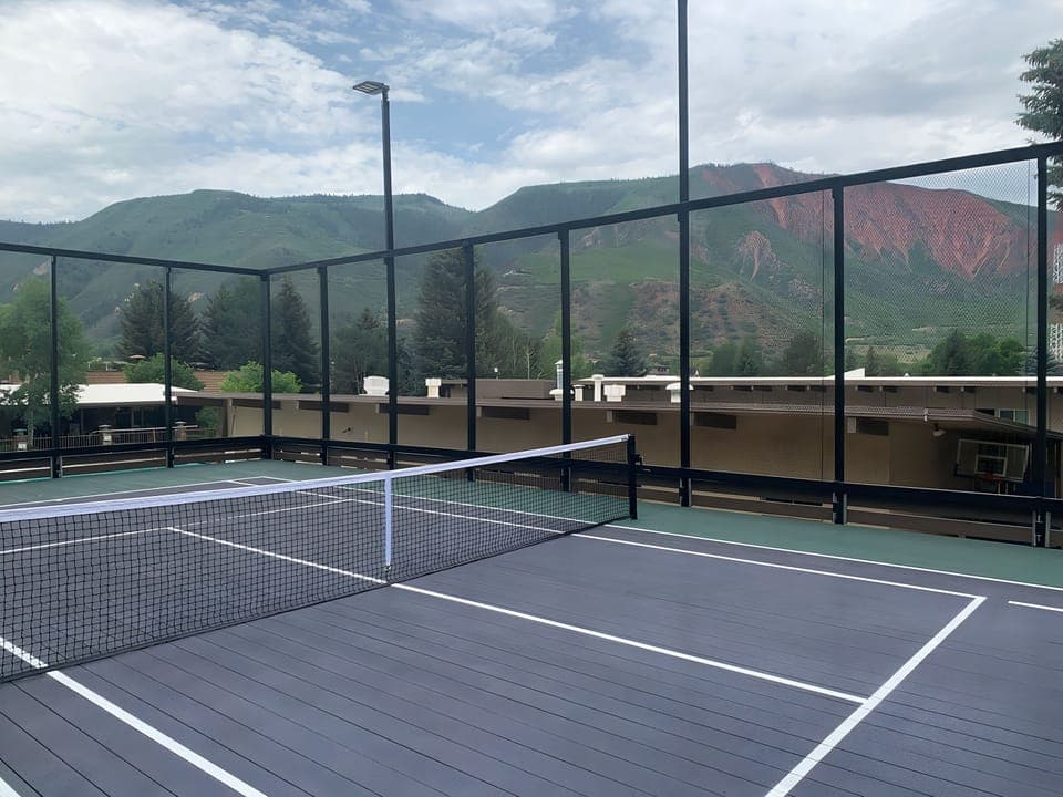 Serve up sunrise matches with sweeping mountain views.