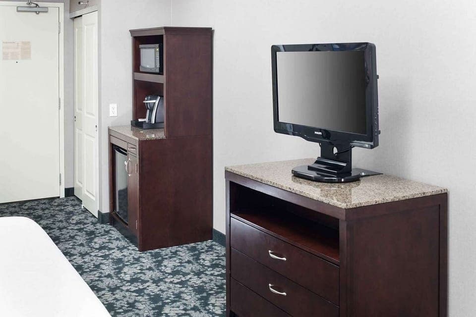 Coffee maker, mini fridge, and microwave cabinet