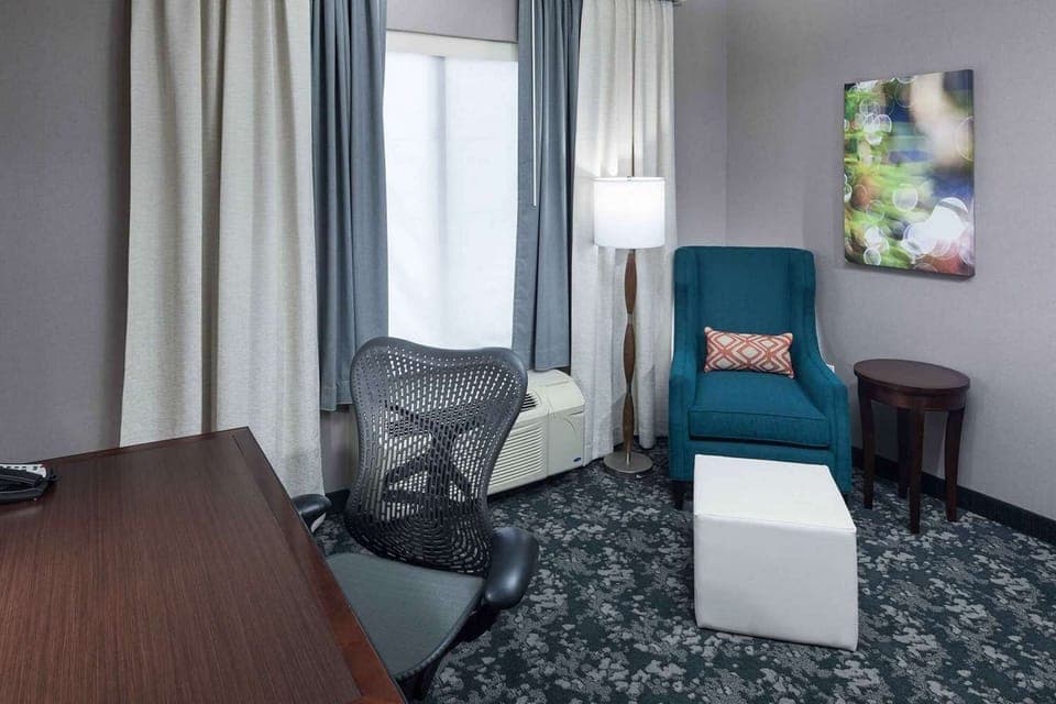 Work desk with chair near window and seating area