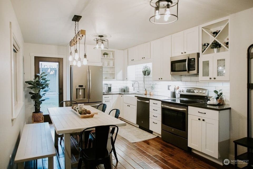 The kitchen is fully stocked with dishes, spices, oil, dishwasher pods, etc.