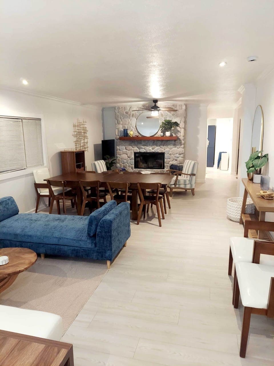 Expansive living room with dining. Multiple areas to gather and relax. Dining seats up to 16.