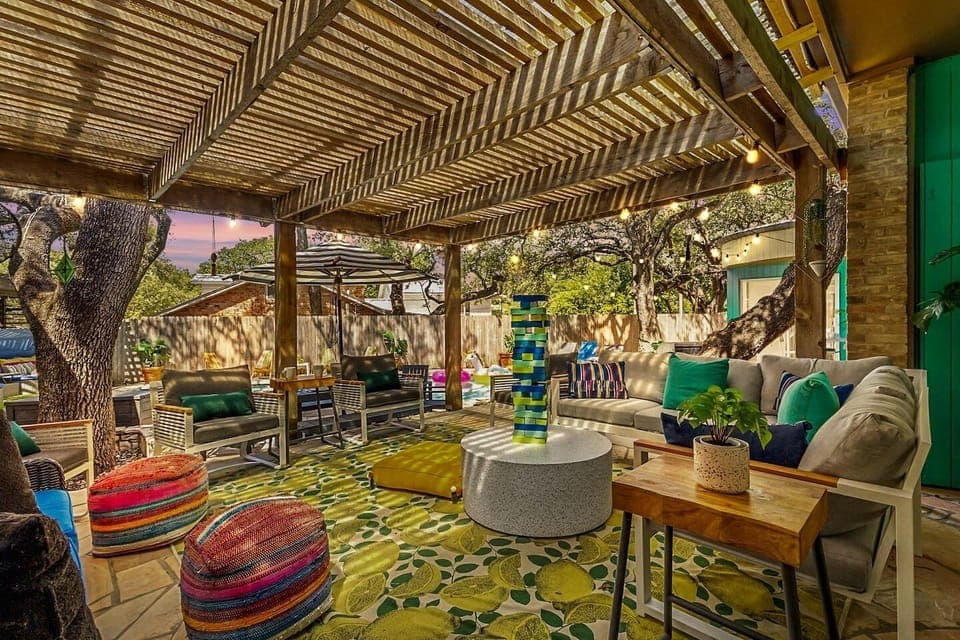 Inviting covered patio oasis with plenty of seating for groups to lounge and enjoy the San Antonio outdoors.