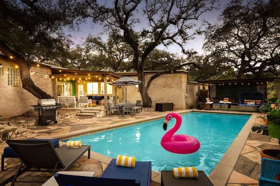 Sparkling private pool with evening ambiance — perfect for relaxing swims and unforgettable San Antonio nights.