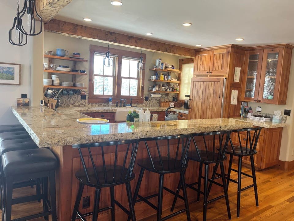 Fully equipped kitchen with modern appliances and ample counter space  