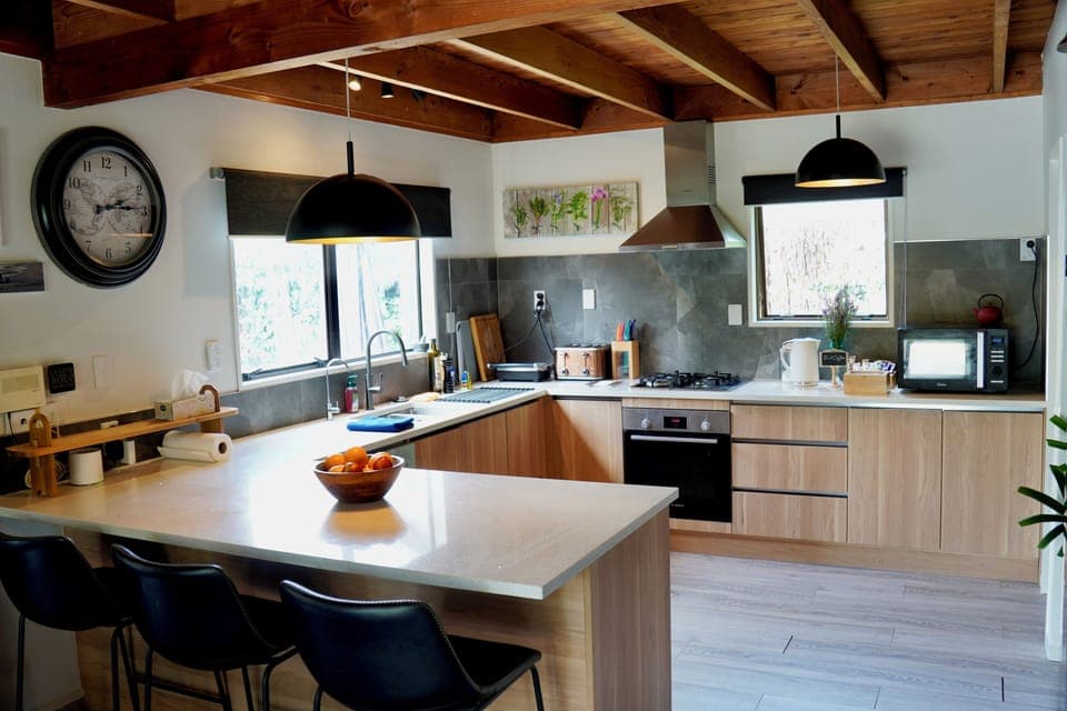 Fully stocked kitchen for home cooking and a complimentary bowl of fruit too!