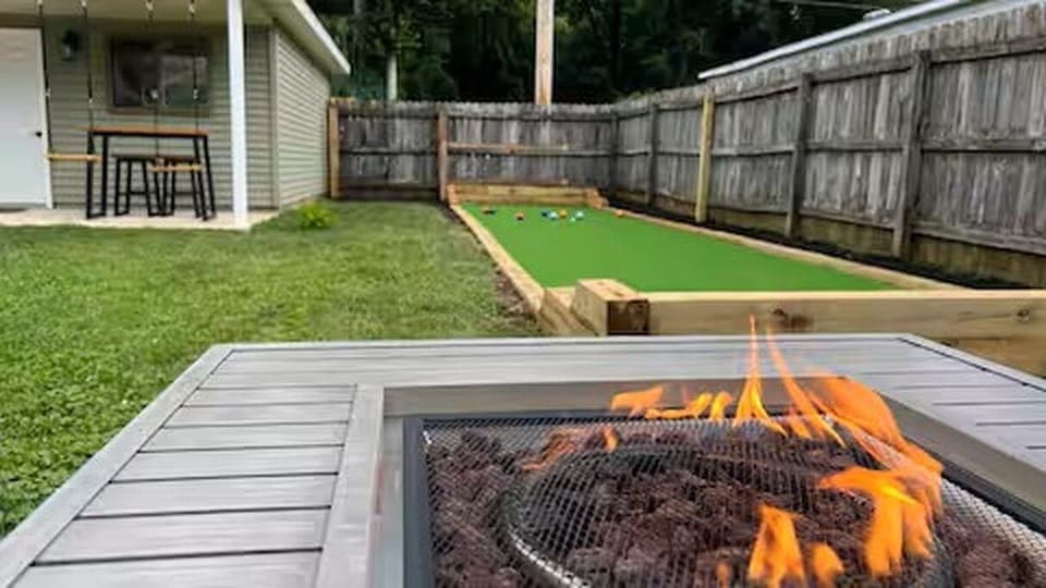
Fire pit with seating area next to the Bocce