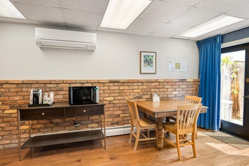 Gather for meals and games at the cozy dining table.