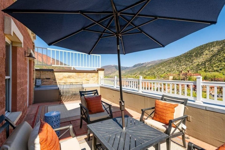 Sip cocktails on the terrace under a shady umbrella.