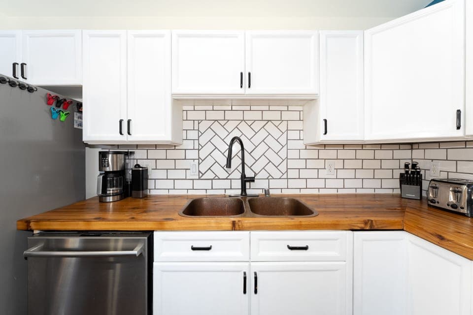 Kitchen featuring dishwasher and double sink.