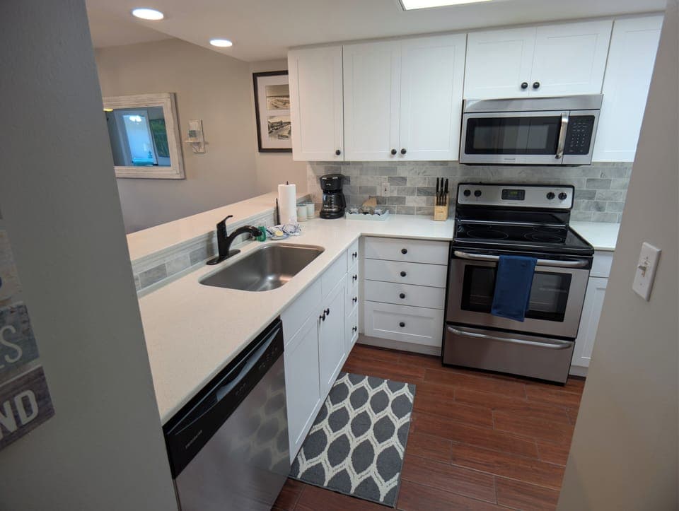 Modern kitchen with solid surfaces, stainless appliances, coffee station and much more.