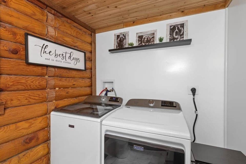 Convenient laundry room with full-size washer and dryer, making longer stays comfortable and stress-free.