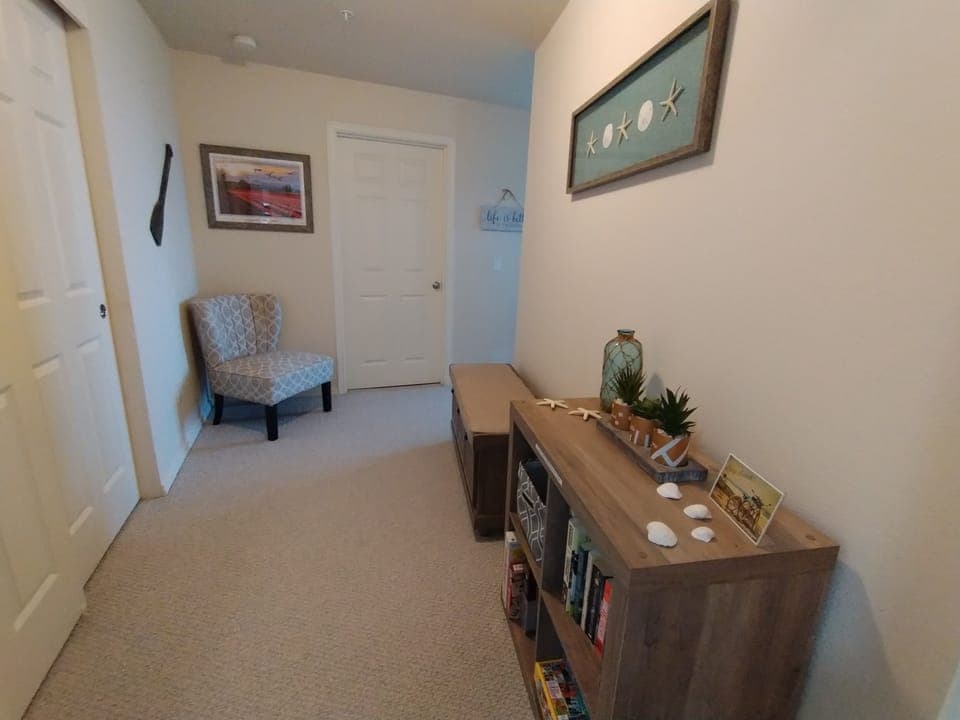 Ensuite closet and dressing area with chair & bench