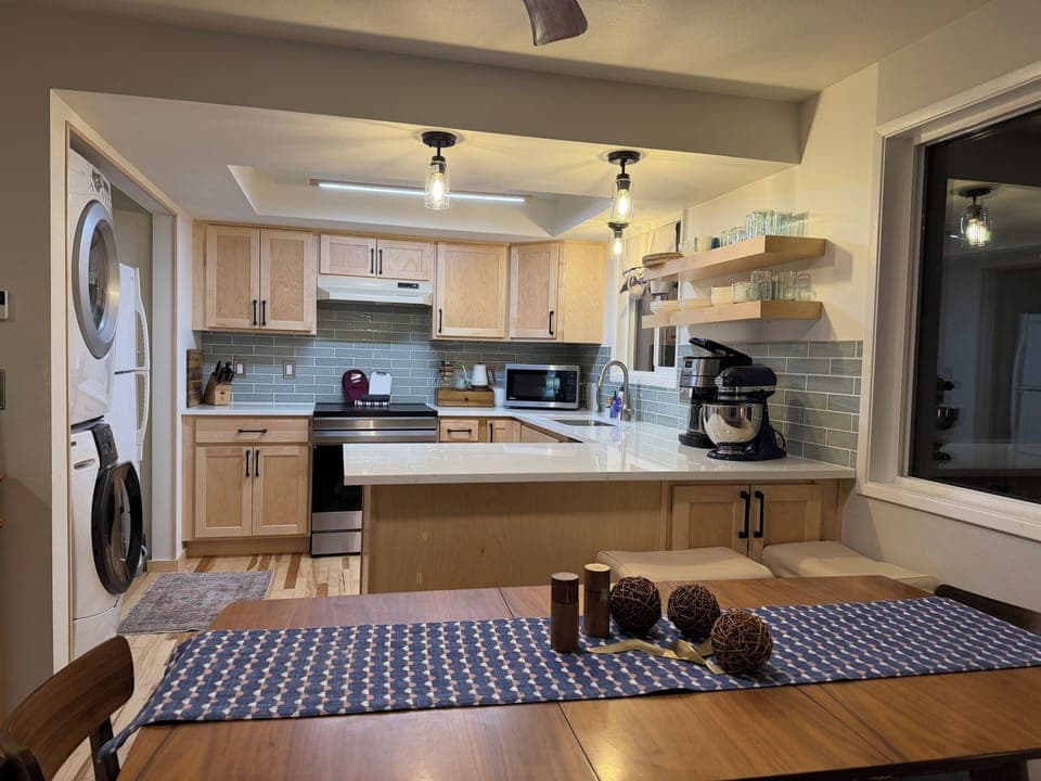 Newly renovated kitchen with quartz counters, solid wood cabinets, W/D
