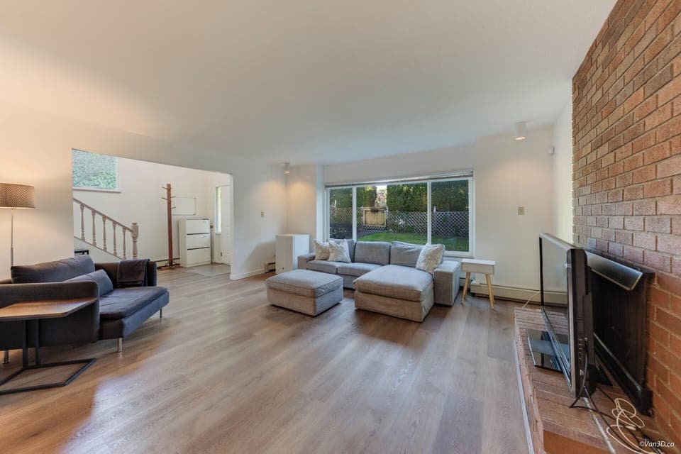 Spacious, living room with comfy seating, big-screen TV mini & fridge.