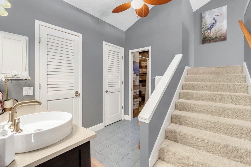 The bedroom is located up the stairs in the ensuite