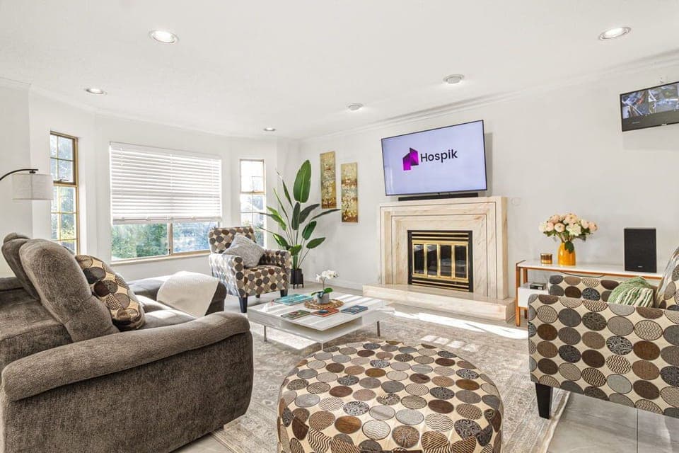 Spacious living room ideal for family time, with L-shaped sofa and large TV