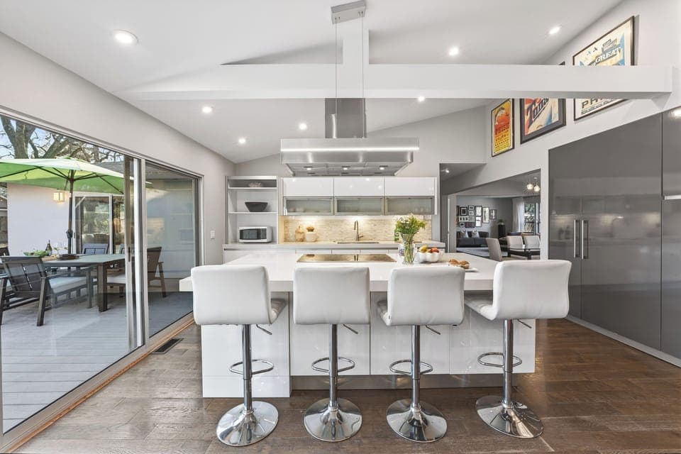 Bright, open kitchen designed for easy hosting, with seamless flow to indoor and outdoor gathering spaces.