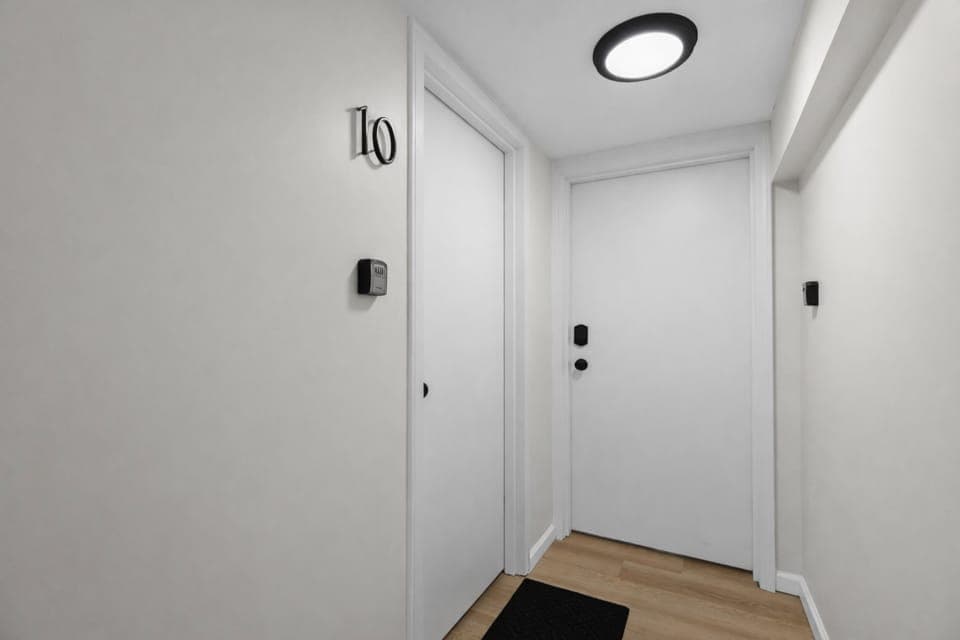 Clean, well-lit private entry with secure access and modern finishes—welcoming you into a comfortable, thoughtfully designed stay.