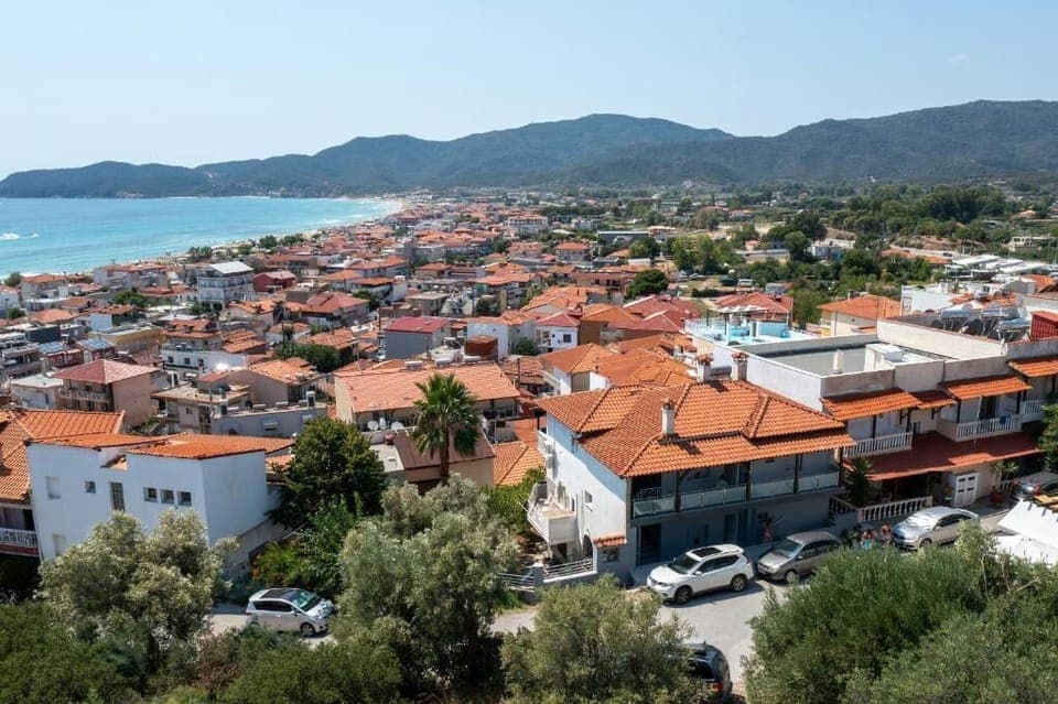 Aerial View of Sarti Village and Sandy Beachfront