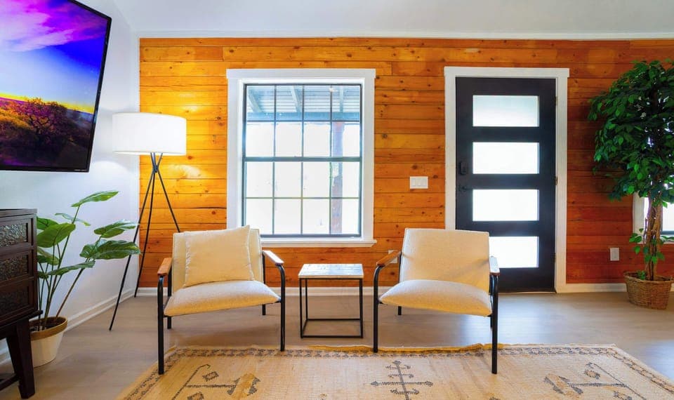 Colorful living area with ample seating and Smart TV