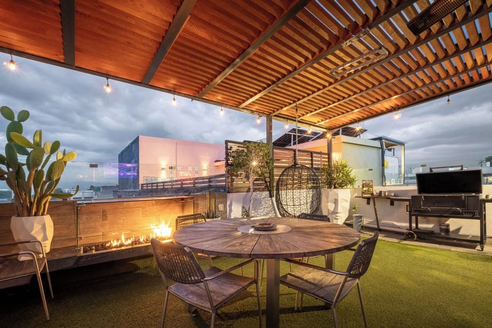 Private terrace, dusk, fire pit on