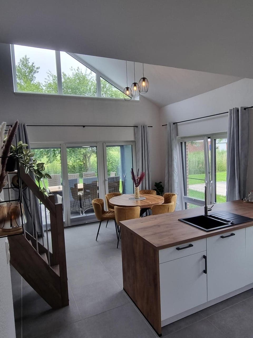 Modern Kitchen with Dining Table and Large Windows