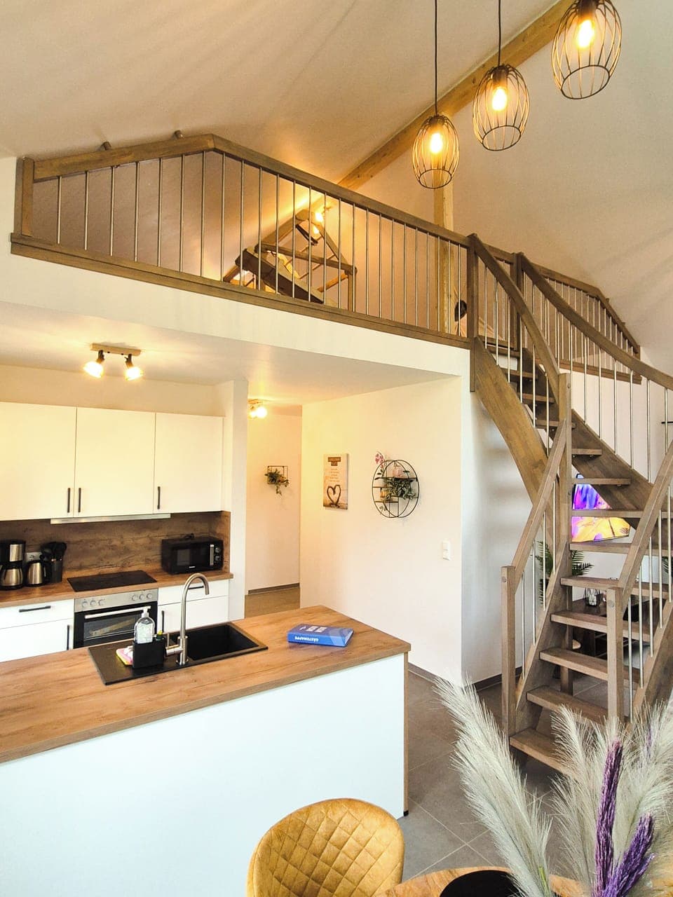 Modern Kitchen with Wooden Countertop and Staircase