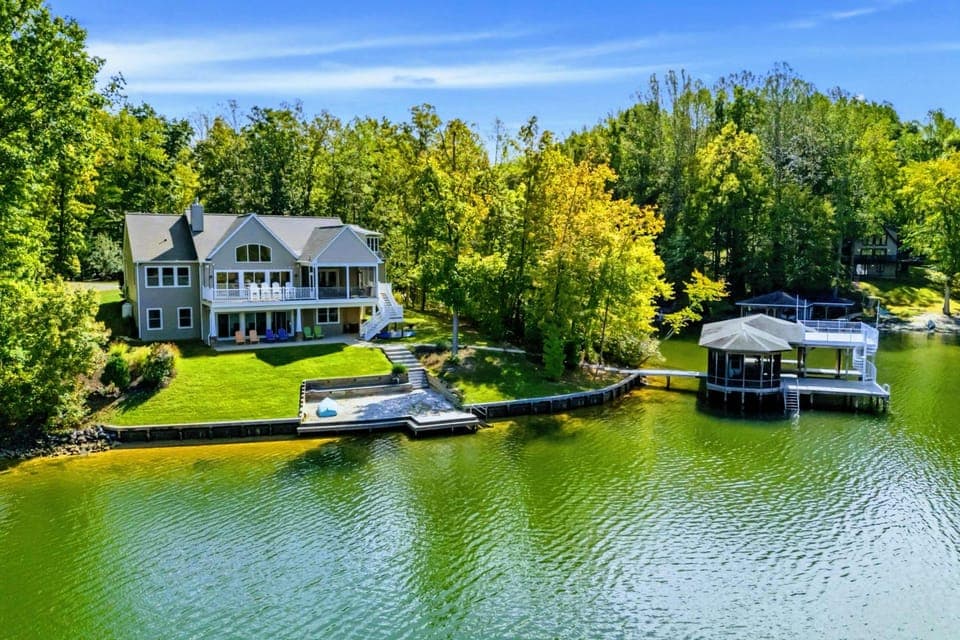 Outdoor Living - Expansive yard and deck spaces connect the home to the waterfront.