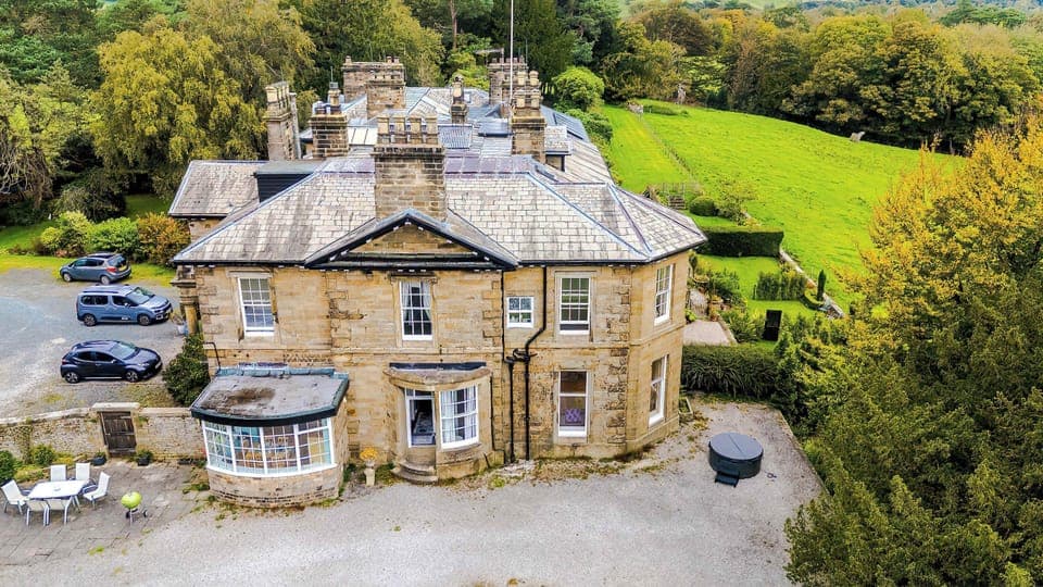 Charming Exterior: Bask in the beauty of lush gardens and stunning architecture at this historic retreat!Charming Exterior: Bask in the beauty of lush gardens and stunning architecture at this historic retreat!