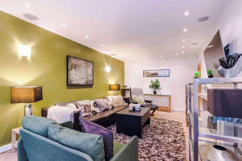 Living Room: Stylish retreat with plush seating, ambient lighting, and vibrant decor awaits you!