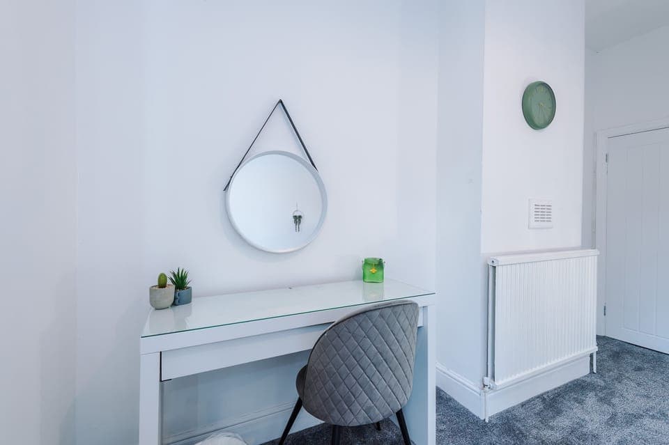 Writing Nook: Bright corner desk with chic decor, perfect for savoring morning coffee or brainstorming!
