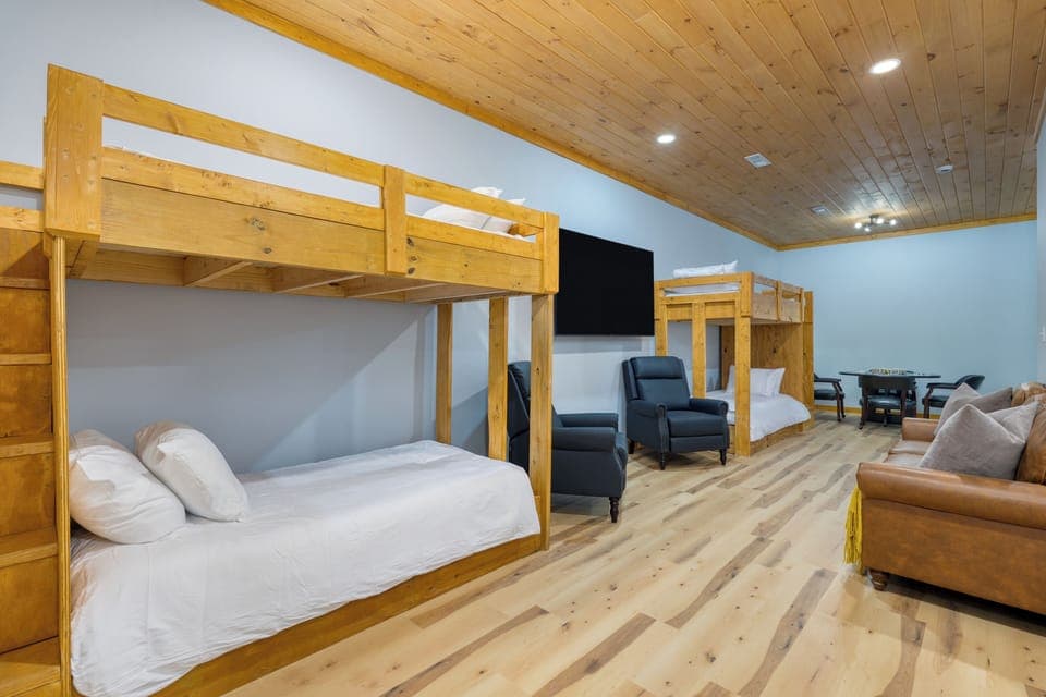 Bedroom 3 features 2 sets of twin bunk beds, a TV and a poker table. (Perfect)