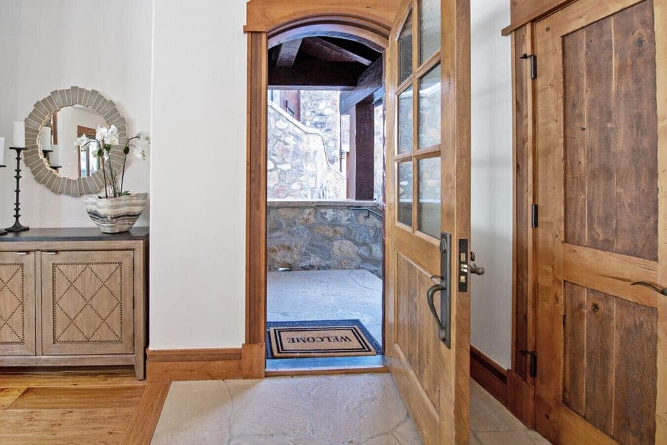Welcome home. The grand entrance sets the tone, with heated walkways from driveway to door ensuring safe, effortless access year-round. No icy steps, no shoveling, just seamless arrival to your luxury mountain home where every detail has been considered.