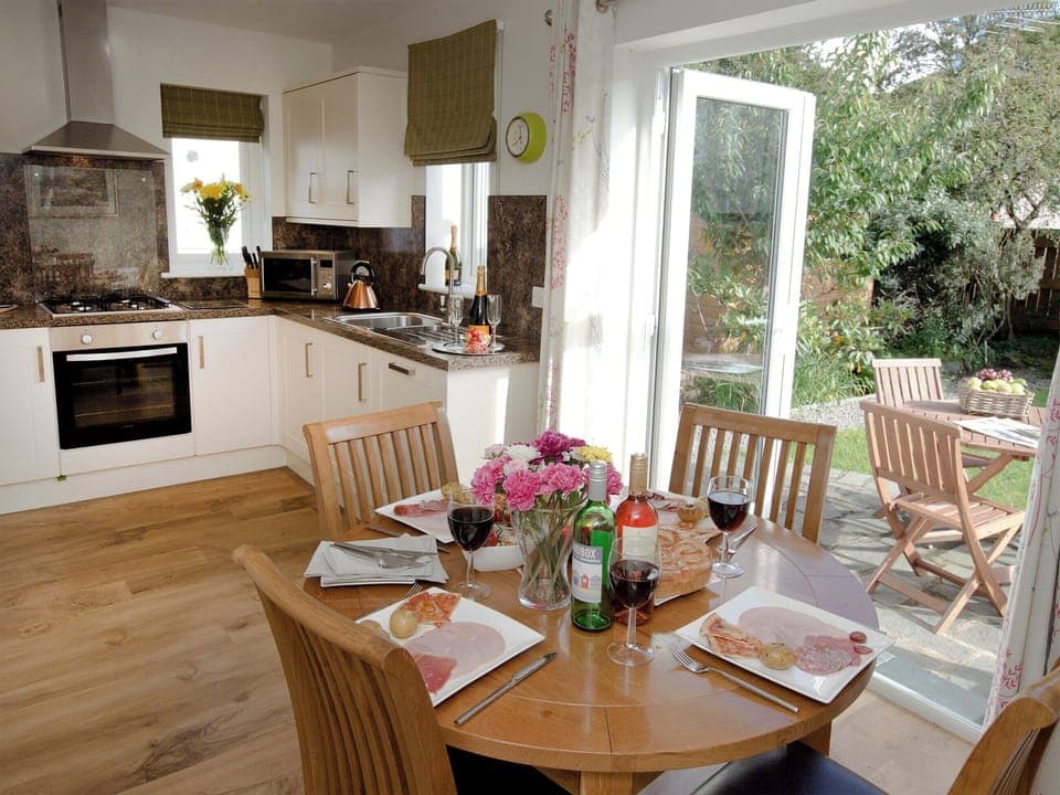 Dining area convenient to kitchen and garden | Elmcot, Keswick