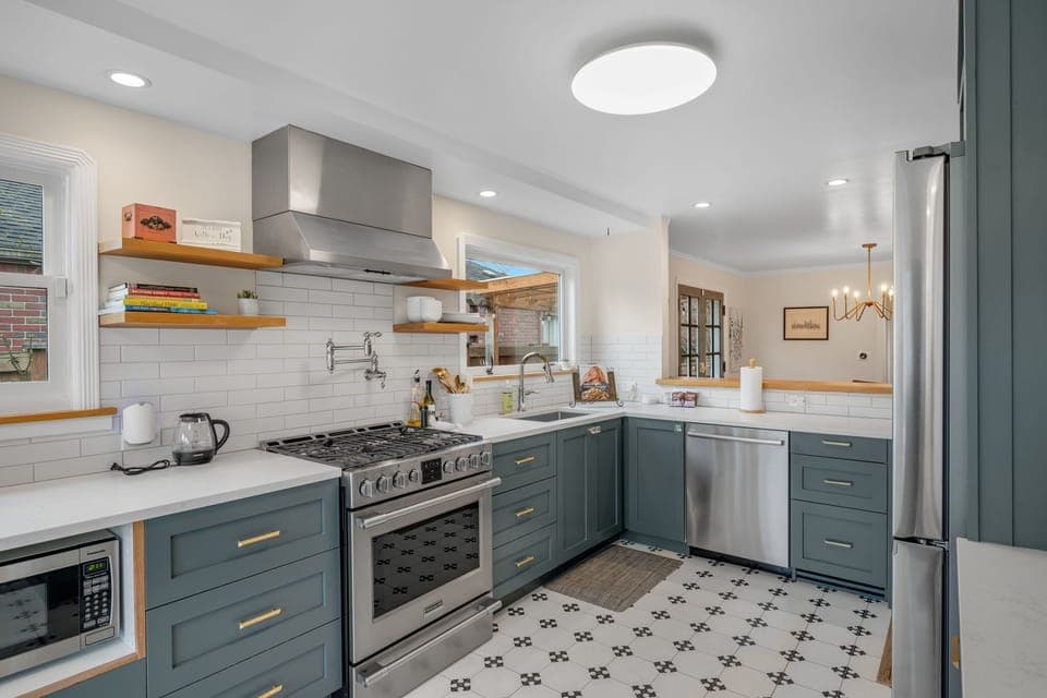 Fully equipped kitchen with modern appliances and ample prep space.