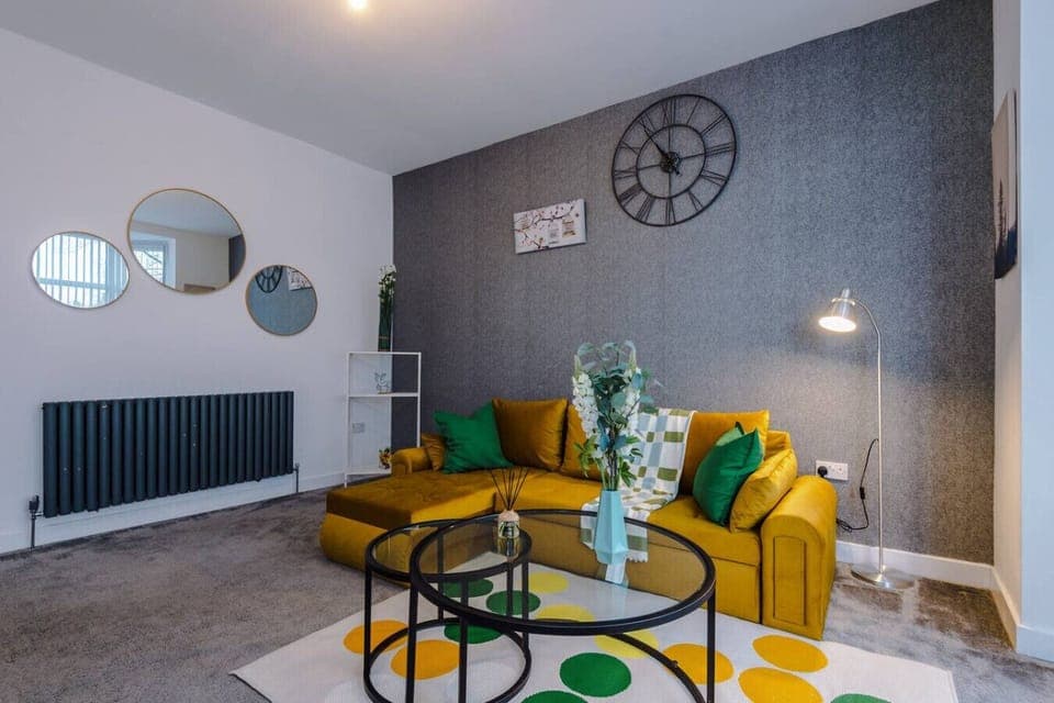 The living room seating area is arranged around the coffee table for group use.