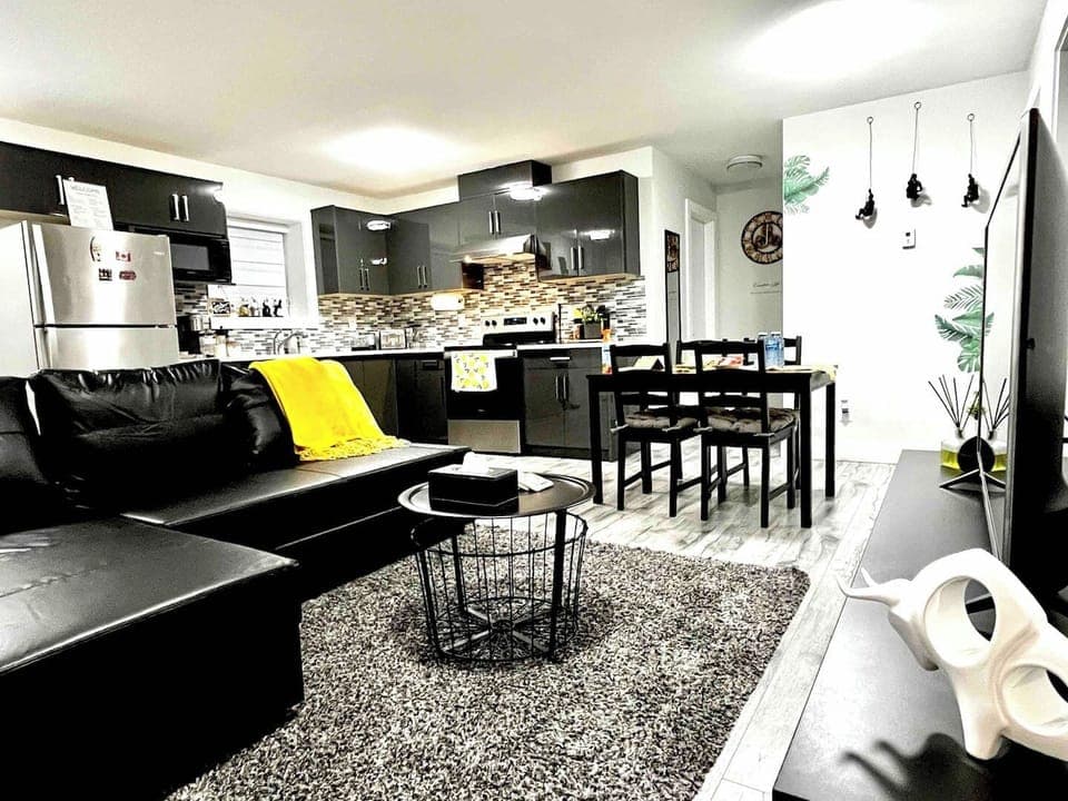 Living room with super comfortable leather sofa bed, LG Television with over 2000 channels. 