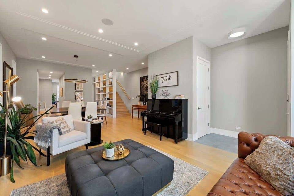 Open-concept living area flows effortlessly, offering multiple seating spots to gather or unwind.