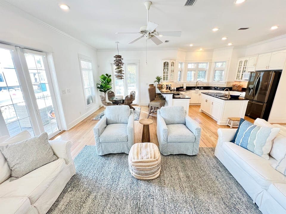 The open concept space between the kitchen, dining area, and living room encourage everyone to connect. 